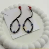 Embrace Divine Protection and Elegance for Your Little One. Keep your baby safe and stylish with our handcrafted Kanhaji Jewels (KJJ) Nazariya bracelets. Specially designed for delicate wrists, these bracelets combine traditional protection with the premium quality of 92.5 Sterling Silver. Each bracelet features imported 2.5mm pure silver balls nestled between classic black beads and vibrant blue evil eye charms. The adjustable black thread ensures a soft, comfortable fit that grows with your child, making it the perfect gift for newborns and toddlers alike. Key Features: Certified Purity: Crafted with genuine 92.5% Sterling Silver components for lasting shine and durability. Imported Silver Beads: Features premium 2.5mm silver balls that add a touch of luxury to the traditional design. Ultimate Protection: The blue evil eye charms are traditionally believed to ward off negativity and keep your little one safe. Gentle on Skin: Made with high-quality, non-irritating materials suitable for sensitive baby skin. Perfect for Gifting: An ideal choice for baby showers, naming ceremonies (Namkaran), or first birthdays. Product Specifications: Brand: Kanhaji Jewels (KJJ) Material: 92.5 Sterling Silver & High-Grade Black Thread Silver Ball Size: 2.5 mm Set Includes: 1 Pair (2 Bracelets)